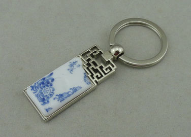 1,5 pouces Keychains de publicité en alliage de zinc avec le morceau de porcelaine inséré