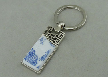1,5 pouces Keychains de publicité en alliage de zinc avec le morceau de porcelaine inséré