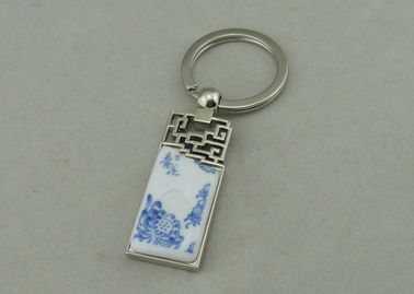 1,5 pouces Keychains de publicité en alliage de zinc avec le morceau de porcelaine inséré